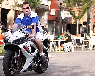 Rosetta Stone owner Greg Sop rides his Suzuki GSXR down West Federal Plaza for "Rally in the Valley" Sunday June 14, 2009
Lisa-Ann Ishihara