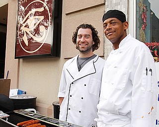 Steve Horvat of Canfield and Larry Newell of Youngstown stand outside their place of employment Rosetta Stone while grilling food for "Rally in the Valley" Sunday June 14, 2009
Lisa-Ann Ishihara