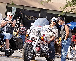 Seanus McClung of Canfield, Frank Guzman of Poland and John Pero of Hubbard talk shop during the bike gathering "Rally in the Valley" Sunday June 14, 2009
Lisa-Ann Ishihara