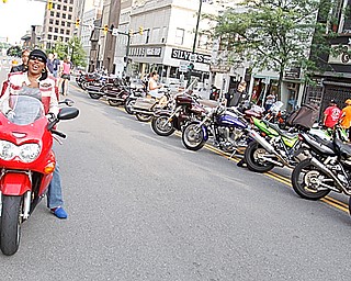 National Vice President of Ridaz Block Motorcycle Club Myzchiff of Youngstown talks with Shaunte Williams of Youngstown while she's on her Suzuki Katana on West Federal Plaza for "Rally in the Valley" Sunday June 14, 2009
Lisa-Ann Ishihara