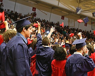 Far right, David Yohman keeps his cap as his fellow classmates throw them into the air at Austintown Fitch High School's Class of 2009 commencement Sunday June 14, 2009
Lisa-Ann Ishihara