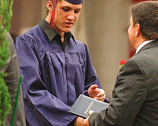 Mohamed Ramahi receives his diploma at Austintown Fitch High School's Class of 2009 commencement Sunday June 14, 2009
Lisa-Ann Ishihara