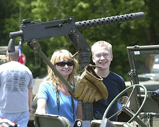 a machine gun mounted in a wwII jeep w/ baseball glove - draws the attention of Cheryl Thompson and her son Joel of East Palestine - the MVPA 2009 Transcontinental Motor Convoy arrives in East Palestine Monday afternoon - robertkyosay