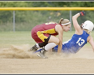 6.16.2009
Mooney's Katie Hughes (9) braces for impact with the ball as Maplewood's Parra Snyder (13) slides into second base during the top of the third inning at Candlelite Knolls in Bazetta Ohio on Tuesday afternoon. Hughes was able to hold onto the ball outting Snyder.
Photo by: Geoffrey Hauschild