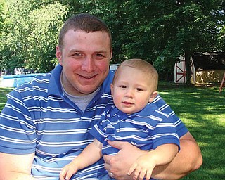 Nick Blanch, 29, and Nicholas, 2, of Poland.
