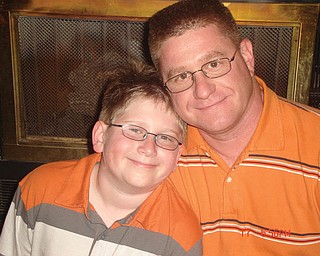 Bill Tomory, 39, and Jake, 12, of Canfield.                               
