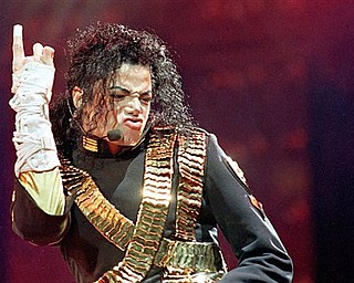 FILE - In this Aug. 25, 1993 file photo, American pop star Michael Jackson performs during his "Dangerous" tour in Bangkok. (AP Photo/Jeff Widerner, file)