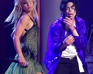 FILE - In this Friday, Sept. 7, 2001 file picture, Michael Jackson performs "The Way You Make Me Feel" with Britney Spears during Jackson's "30th Anniversary Celebration, The Solo Years" concert at New York's Madison Square Garden. (AP Photo/Beth A. Keiser, Pool)