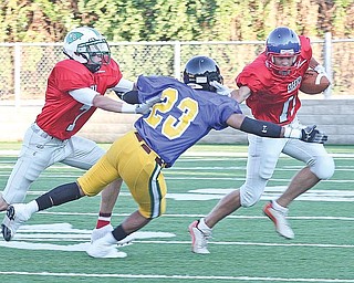ALL STAR - Justin Lude of Western Reserve avoids the tackle of (23) Terry Patrick as (7) Chad Butcher throws a block Friday night. - Special to The Vindicator/Nick Mays