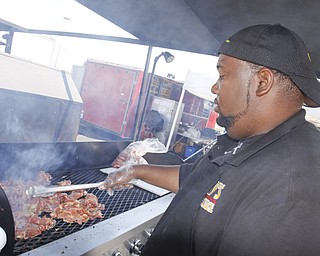 Representing Guy's BBQ in Newton Falls, Steve Jackson cooks pulled pork at the Mahoning Valley Rib Burnoff Saturday June 27, 2009
Lisa-Ann Ishihara