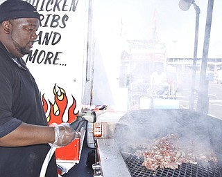 Representing Guy's BBQ in Newton Falls, Steve Jackson cooks pulled pork at the Mahoning Valley Rib Burnoff Saturday June 27, 2009
Lisa-Ann Ishihara