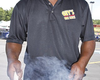 Representing Guy's BBQ in Newton Falls, Kevin Hughes cooks ribs at the Mahoning Valley Rib Burnoff Saturday June 27, 2009
Lisa-Ann Ishihara