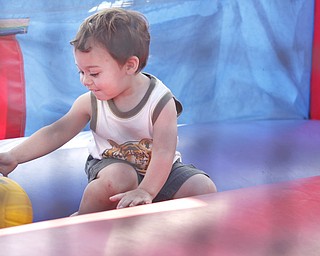 Colton Huff (21 mths) of Cortland plays inside an inflatable slide/play area at the Mahoning Valley Rib Burnoff Saturday June 27, 2009
Lisa-Ann Ishihara