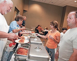 Bob Viglio and Angela Cimonetti serve Lisa and Eric Rosko during the spaghetti benefit dinner for the Maria Viglio Ursuline High School Scholarship Fund at St. Christine Parish Center. Family and friends working the event, Bob is Maria's brother in law and Angela is a very close friend of the family, Sunday June 28, 2009

Lisa-Ann Ishihara