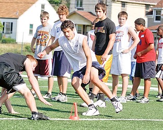 Tyler McNally (14) of Struthers races against Dean Steliotes (14) of Pittsburgh, PA during Cardinal Mooney Camp of Champions at the football field, Monday June 29, 2009

Lisa-Ann Ishihara