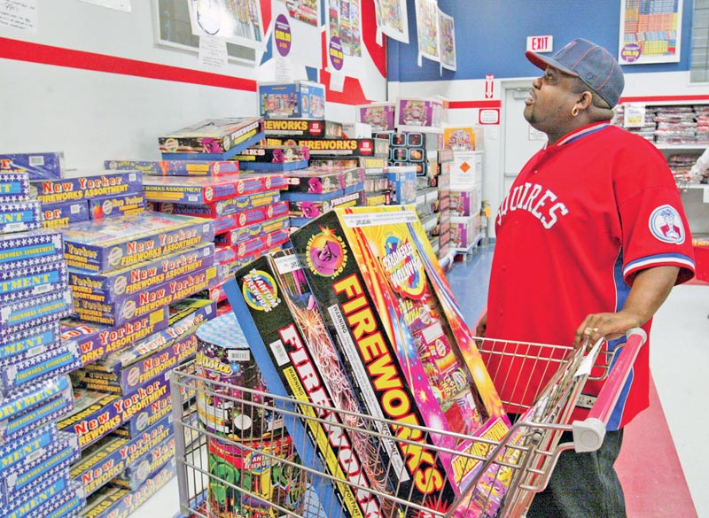 JULY FOURTH FIREPOWER: Barry White of Duquesne, Pa., shops for fireworks at Phantom Fireworks on Market Street in Youngstown.
