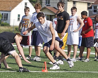 Tyler McNally (14) of Struthers races against Dean Steliotes (14) of Pittsburgh, PA during Cardinal Mooney Camp of Champions at the football field, Monday June 29, 2009

Lisa-Ann Ishihara