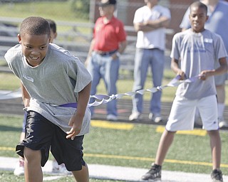 Jared Perdue (9) of Youngstown and Aaron Woodberry (11) of Youngstown participate in an exercise to test their agility during Cardinal Mooney Camp of Champions at the football field, Monday June 29, 2009

Lisa-Ann Ishihara