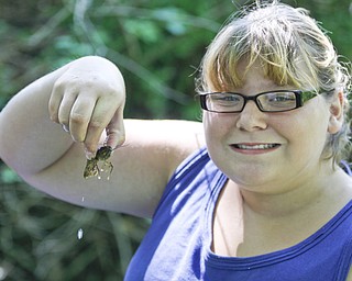 Alexis Penick (12) of Liberty holds a crayfish in the creek at summer day camp in Churchill Park in Liberty run by Rose Buhley, Monday June 29, 2009
Lisa-Ann Ishihara
