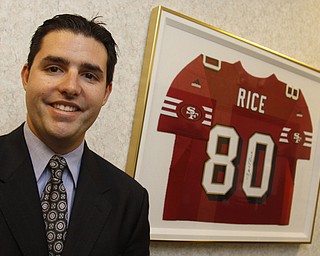 Jed York stands next to a Jerry Rice jersey at DeBartolo Corporation in Boardman, Monday June 29, 2009

Lisa-Ann Ishihara