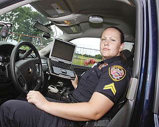 Cp. Brenda Golec of the Goshen Police Department, which covers Goshen, Beloit and Green, sits in the passenger seat of  the P.D.'s new Chevy Tahoe where she can access www.nixle.com to get updated on traffic changes, accidents or crimes for free. Or through free text messages. Tuesday June 30, 2009

Lisa-Ann Ishihara