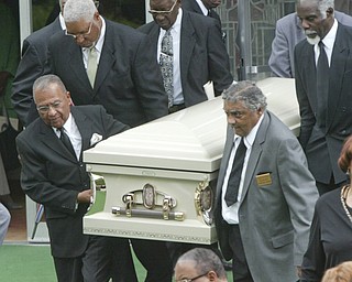 Pallbearers carry the casket of Edna Pincham from Third Baptist Church in Youngstown following Wednesday funeral services.