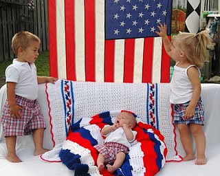 Tom and Erin Chizmar of Youngstown share this picture of their three grandchildren celebrating the Fourth of July and Caleb’s (left) second birthday. With him are Cameron, center, who was born on Memorial Day in 2008, and Scarlet.
