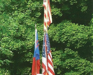 Members of the Austintown Fitch Color Guard participating in the Fourth of July Flag Raising Ceremony at the Austin Log Cabin in 2008 are, from left, captain Liana DeFuria, co-captain Alissa Breakiron, and standing guard Katie Fabrizio, Samantha Devenport and Alyssa Yacovone, all of Austintown.