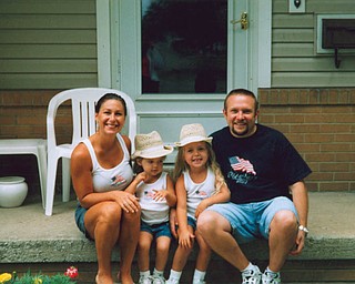 All decked out for a Canfield parade are members of the Kabetso family, Jessica, Olivia, Zoe and Gary of Canfield.