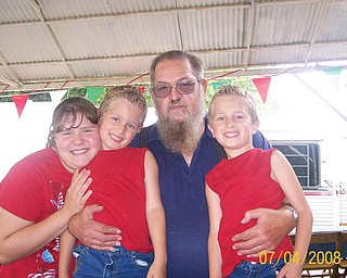 Charles Gordon is pictured last year on July 4 at a family party with, from left, his niece, Breanna Armeni, and twin nephews, Jacob and Jarid Armeni.
