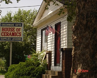 Ian Andrews says flags were placed on this Midlothian Boulevard building last year to celebate the Fourth of July as a small, low-cost symbol that the building is cared for and the neighborhood is regenerating and transforming slowly into a real “heart of Midlothian.” The same was being done this year.
                               
