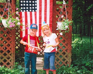 David and Lee Culp sent this picture of their grandkids, Robbie and Kassie Williamson, taken last year on the Fourth of July. They noted that the hand-sewn flag has 48 stars and was given to them by a treasured “senior” friend.