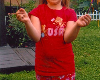 Emily DeMain, 6 1/2, of Boardman attended the annual Fourth of July party at Jill and Joe Cole’s in Boardman last year.