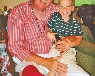 William Simons of Boardman and his grandson, Carter Simons of Youngstown, share Fourth of July birthdays. Carter, 4, is a son of Jason and Cathy Simons of Youngstown.