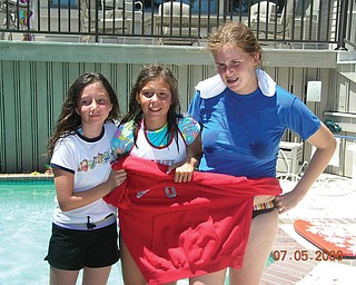 Katin Angelo, right, of Canfield and her cousins, Hannah and Ashley Angelo of Massillon, were required to wear red, white and blue during a family scavenger hunt while on vacation at Hilton Head Island in 2006.