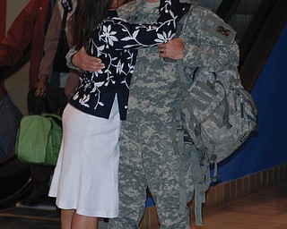 Christopher D. Lawson of San Diego, Calif., is greeted by his wife, Justine, formerly of Campbell, as he safely returned from Afghanistan a year ago. Their nephew, Brandon Suverison of Boardman, captured the moment at Pittsburgh International Airport.