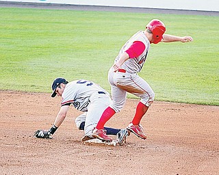 SCRAPPERS - Carl Uhl (2) of Williamsport beats Short Stop Kyle Smith to the bag Thursday night at Eastwood Field.