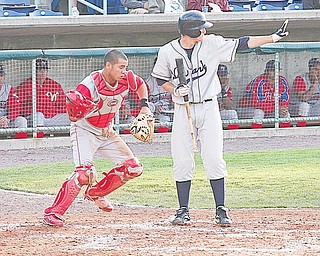 SCRAPPERS - Catcher Sebastian Valle goes after a loose ball as (22) Kyle Bellows holds a teammate on third Thursday night at Eastwood Field.