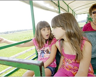 7.5.2009
Gianna Socciarelli, 7 of Canfield, and Hanna Medved, 9 of Vienna, notice a groundhog in the field alongside a tractor ride at Mill Creek MetroParks' Farm in Canfield on Sunday afternoon.
Geoffrey Hauschild