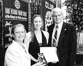 Special to The Vindicator
THREE OF A KIND: The Rotary Club of Youngstown presented the Paul Harris Fellow award to Miranda Young at the annual Presidents Ball on June 24. The presentation was made in recognition of her work as head of the mentoring program with Rotary’s “Put Kids First” project. Young, an associate in the Youngstown office of Hill, Barth and King, center, is joined by Carol Sherman, at left, and Frank Kishel, past recipients of the award, which is the highest honor bestowed upon a member of Rotary International.
