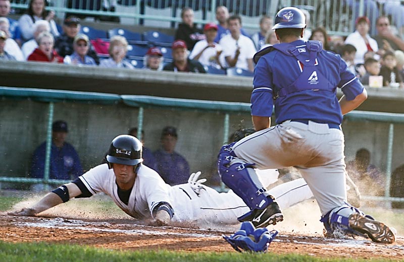 Scrappers Kyle Bellows (22) slides into home plate safely before Auburn Doubledays catcher Yan Gomes (5) can get him out during the 4th inning, Tuesday July 7, 2009

Lisa-Ann Ishihara