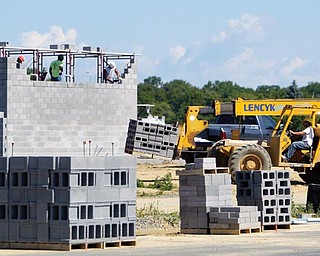 Brick masons for Lencyk Masonry of Boardman work to put in the middle school wing at the facility being built on St Rt 46 - Green Twp - at the South Range Local Schools Building Project - robertkyosay