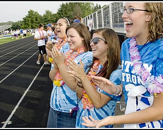 7.10.2009
(RIGHT TO LEFT)Members of the Stay Strong 31 team, Jocelyn Penny, 17, Erin Crist, 18, Paige Brewer, 17, and Emily Cunninghham, 16, cheer as Mitch Pinopoulos walks past during the inital lap of of Poland's Relay For Life at the High School Stadium on Friday evening. Poland High School students and alumni created the "Stay Strong 31" team in recognition of Pinopoulos, a Poland High School Student, who was diagnosed with brain cancer last December.
Geoffrey Hauschild