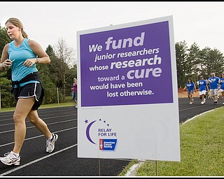 7.10.2009
Amanda Watanakunakorn, of Canfield, runs for a friend surviving Leukemia, at Poland High School's Stadium during the Relay for Life on Friday evening.
Geoffrey Hauschild