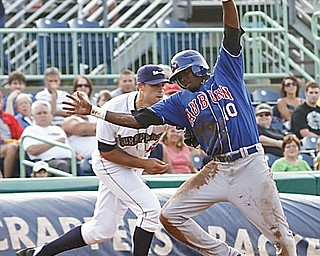 Scrappers Kyle Smith (32) tags Auburn Doubledays Markus Brisker (10) after he tried to steal 3rd base during the first inning, Thursday July 9, 2009