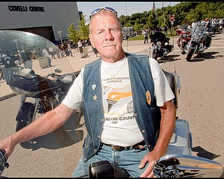 7.12.2009
Bob Hudak, a retired Youngstown Police Officer and resident of Boardman, sits on his motorcycle outside the Covelli Centre in downtown Youngstown on Sunday afternoon. A twenty plus year veteran of the YPD, Hudak, now 72, has participated in all seven of the annual rides, having been friends with Howard Hertzell, after whom the event was originally named.
Geoffrey Hauschild
