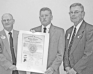 Special to The Vindicator
CELEBRATION: A charter for the newly organized Streetsboro Lions Club is presented by District 13-D Governor Harold Ullman to Ed Lupton, president of the chartered club, as they are joined by Past District Governor Jerry Smith.