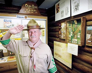 Bill Moss, dressed as Robert Baden-Powell, the founder of the Boy Scouts, poses for a portrait in his museum of Boy Scout memorabilia that was recently completed at Camp Stambaugh.