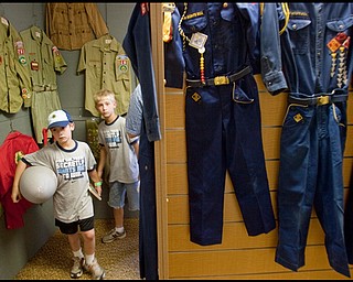 7.16.2009
Ben and Ethan Palo, ages 8 & 9 and members of Cub Scout Pack 220 in Lordstown, wander through an exhibit of past Scouting uniforms while visiting Camp Stambaugh on Thursday afternoon.
Geoffrey Hauschild