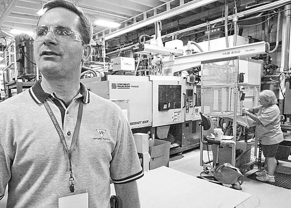 Bryon Osborne, VP Marketing & Sales at Venture Plastics in Newton Falls, at the plant Friday. The company is celebrating 40 years in business.
